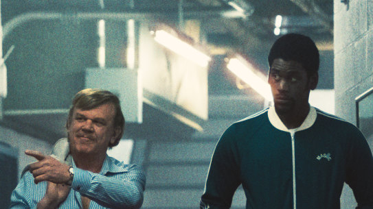 John C. Reilly as Jerry Buss and Quincy Isaiah as Magic Johnson in Winning Time.
