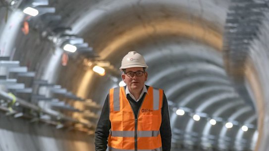 Premier Daniel Andrews walks through the partially constructed Metro Tunnel.
