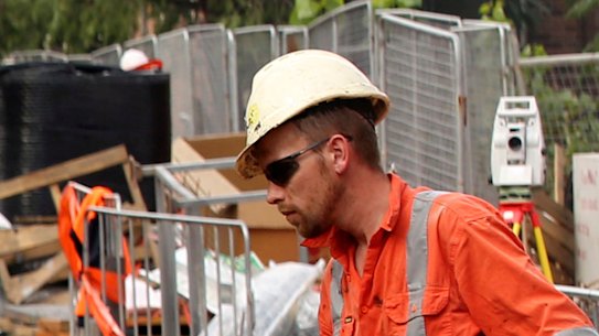 Construction workers and engineers hard at work on a major infrastructure project. 