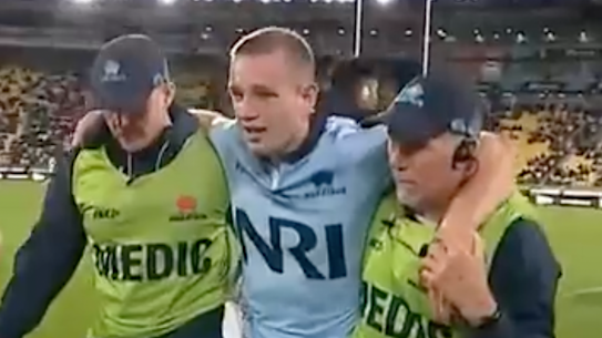 Max Jorgensen leaves the field injured against the Hurricanes