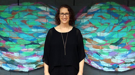 Miriam Fee who teaches visual art at a Melbourne secondary school with her art work. 