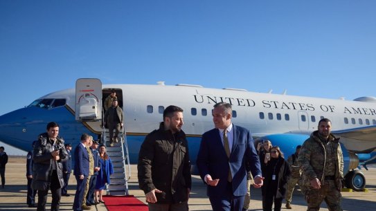 Volodymyr Zelensky is welcomed by US officials after travelling on a US plane to Washington, his first international trip since Russia invaded his country.