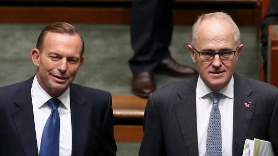 Then prime minister Tony Abbott and then communications minister Malcolm Turnbull arrive for Question Time at Parliament House in 2015.