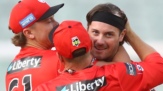 Zak Evans celebrates with teammates after dismissing Nathan Ellis.