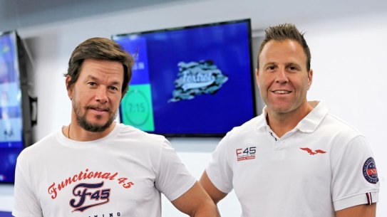 F45 owner Rob Deutsch, right, with actor Mark Wahlberg, who signed up to the company earlier this year after a sale process run by Deutsche Bank.