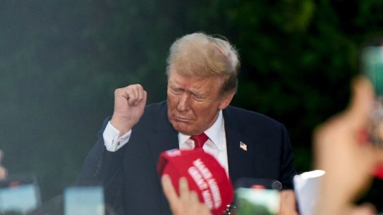 Former US President Donald Trump dances during a campaign event at Crotona Park in the Bronx.