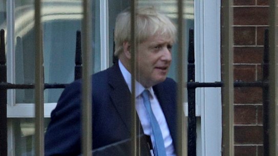 Boris Johnson leaves from the rear of 10 Downing Street on Thursday, on his way to the House of Commons.
