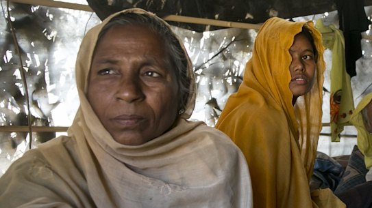 Women and children in a makeshift house they share with six others in a Rohingya refugee camp in Cox's Bazar, Bangladesh, after fleeing from Myanmar's Rakhine state.