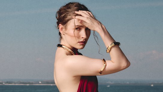 Dress and jewellery by Gucci.