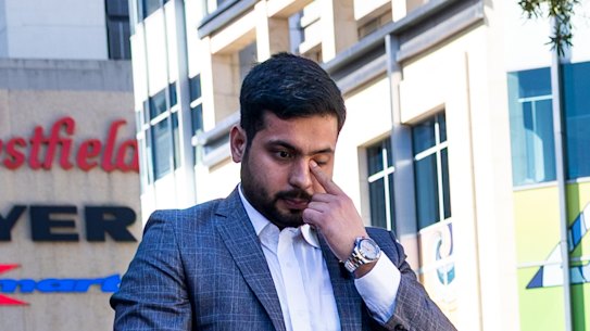 Surviving security guard Muhammad Taha sheds a tear as he lays a bouquet at the memorial on the anniversary of the attack.