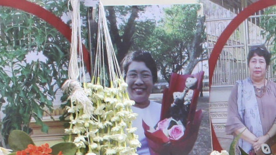 A woman pays tribute to a teacher who killed in Sunday’s protests in Yangon, Myanmar.