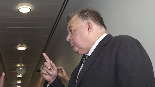 Shadow Minister for Education and Shadow Minister for Women Tanya Plibersek and Liberal MP Craig Kelly have a heated discussion as they cross paths in the corridor of the press gallery in between media interviews, at Parliament House in Canberra on  Wednesday 3 February 2021. fedpol Photo: Alex Ellinghausen