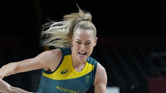 Australia's Tess Madgen (7) drives the ball as China's Liwei Yang (3) runs into Marianna Tolo (14) during a women's basketball preliminary round game at the 2020 Summer Olympics in Saitama, Japan, Friday, July 30, 2021. (AP Photo/Eric Gay)