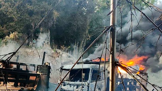 Smokes and flames billow from vehicles in Hpruso township, Kayah state, in Myanmar.