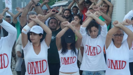 Refugees at Nauru wear t-shirts with Omid Masoumali's name as a show of solidarity.