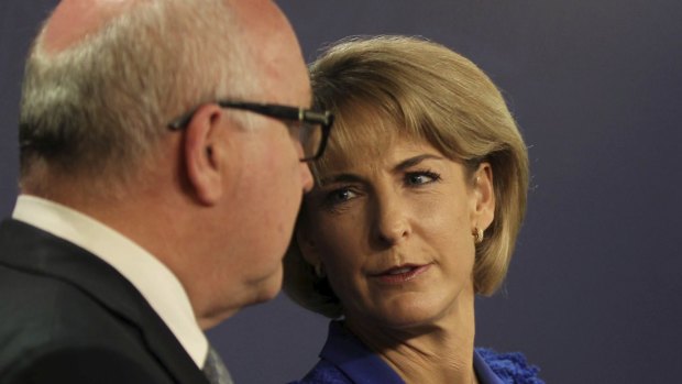 Senators George Brandis and Michaelia Cash have opposed a national anti-corruption body, but have stood by the re-establishment of the Australian Building and Construction Commission.