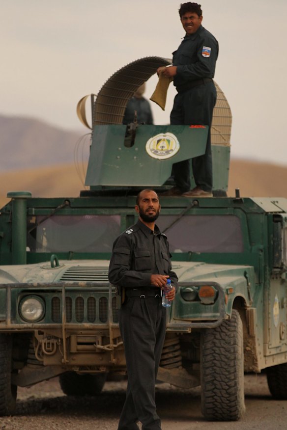 Matiullah Khan in front of his armoured Humvee on the Tarin Kowt to Kandahar highway. The former highway patrol officer charged trucks passing through his fiefdom for safe passage.