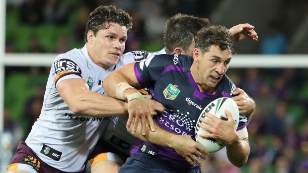Billy Slater of the Storm is tackled.