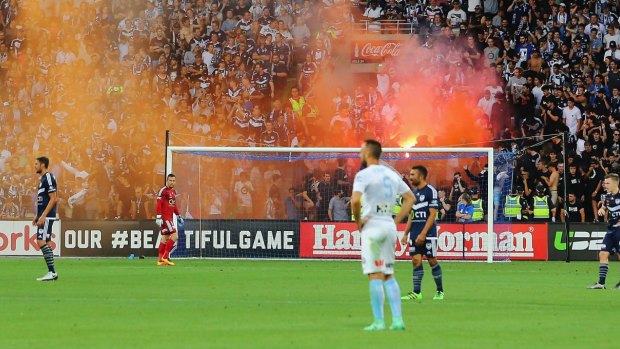 Victory fans let off a flare during goal celebrations.