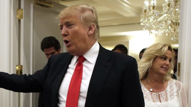 Republican presidential candidate Donald Trump arrives for a news conference at the Trump National Golf Club in Jupiter, Florida.