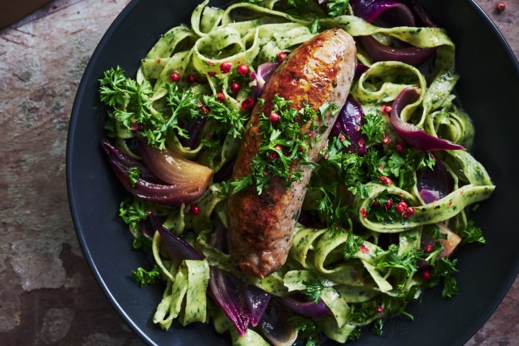 Sticky braised pork sausages with herb pappardelle.