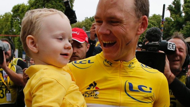 Winners are grinners: Tour de France winner Chris Froome with son Kellan.