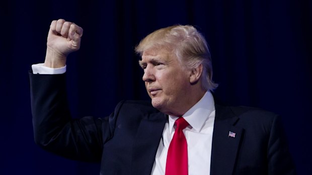 US President Donald Trump gestures on stage during the Conservative Political Action Conference (CPAC) on Friday.