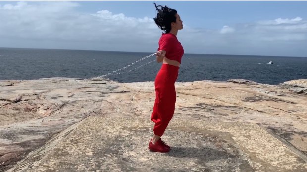 Skipping with chains: Still from Amrita Hepi's video installation, The Pace, 2018.