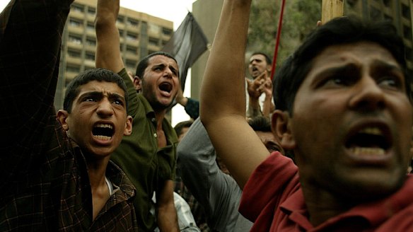 Thousands of Iraqi Shi'ite muslims from Najaf protesting in the streets of Baghdad over the US arrest of their leader Mohammed Al-Fartosi.  21 April, 2003.
