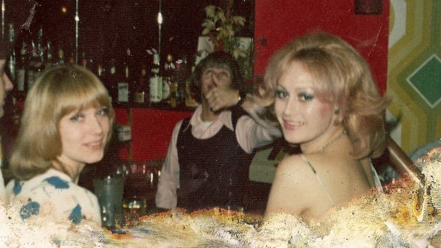 Eddie Trigg behind the bar in the VIP Lounge with Marilyn  King, at right, and Jim Anderson's secretary, Anne.