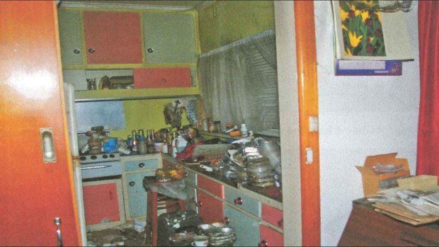 The cluttered kitchen of a Blackburn North woman, a “known hoarder”, who died in a house fire in October 2012.