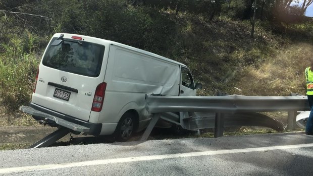 The van crashed into a guard rail on the Pacific Motorway.