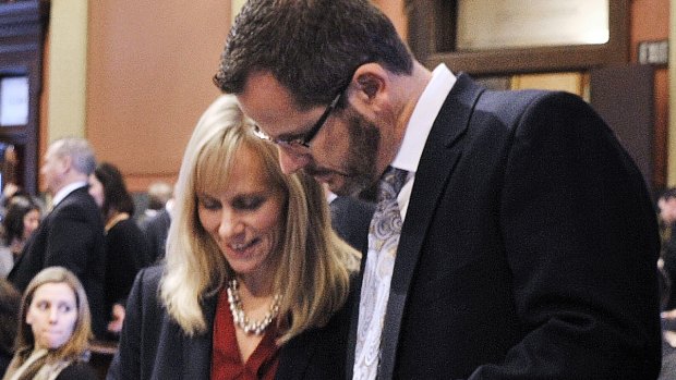 Cindy Gamrat talks with Todd Courser in Michigan's House of Representatives.