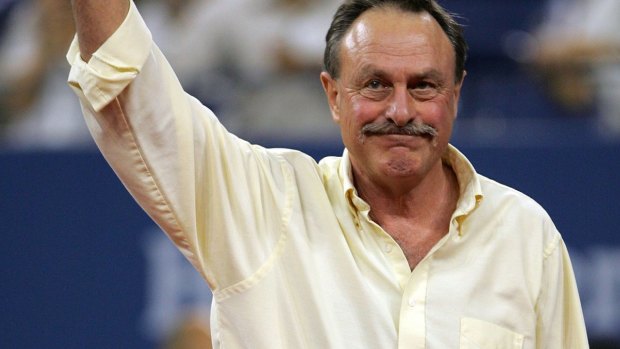John Newcombe has defended Pat Rafter following Bernard Tomic's attack.