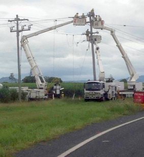 Crews work on a power line in Rockhampton.