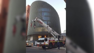 The tree was now expected to arrive at Perth's new public library about midday.