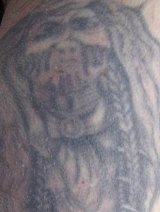 Police have released images of Andy's distinctive tattoos in a bid to identify him.
