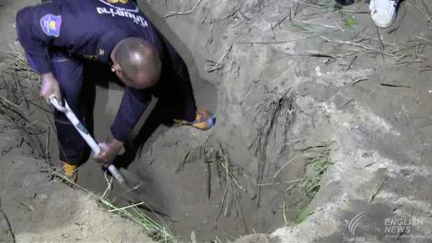Wayne Schneider's body was found in a two-metre-deep grave in roadside bushes near a Chinese temple.