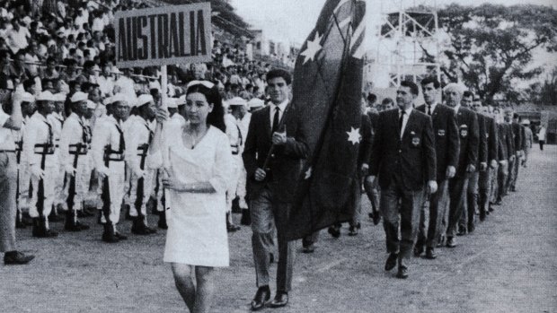 Johnny Warren leads out his squad during the opening ceremony.