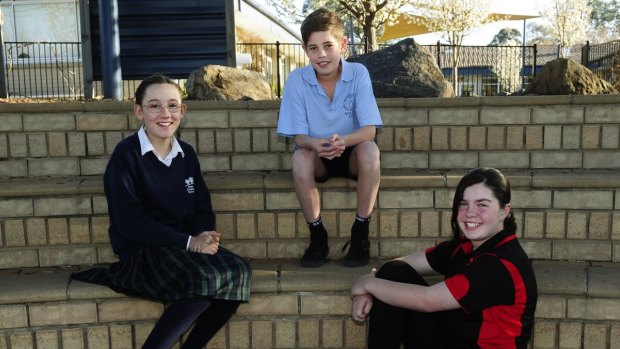 Year 6 students (from left) Lyara McCarron from Trinity Christian School, Matthew Cannon from St Jude's Primary School and Bella Connellan from Mount Rogers Primary School have been nominated for the ACT Fred Hollows Humanity Award.
