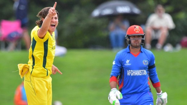 Star on the rise: Jono Merlo picks up one of his four wickets against Afghanistan.