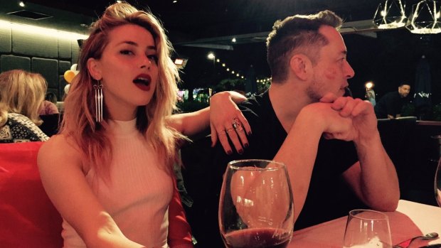 Amber Heard and Elon Musk are treated to some saucy dinner conversation on the Gold Coast.
