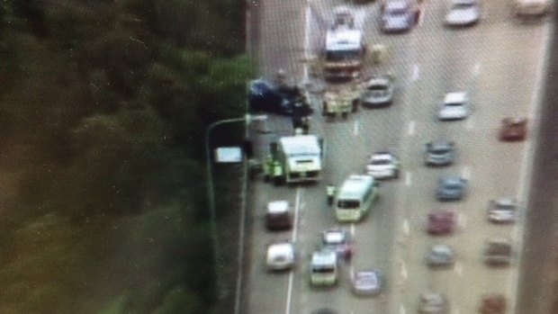 A truck and a police car have collided on the Pacific Motorway near the Helensvale exit.