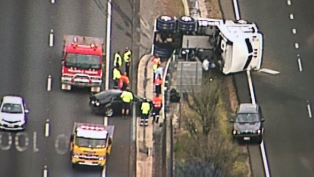 A truck lays on its side on the M1 at Beenleigh in October. A report has listed the Pacific Motorway among the nation's worst roads.
