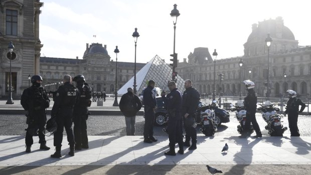 Armed police surround the Louvre on Friday morning.
