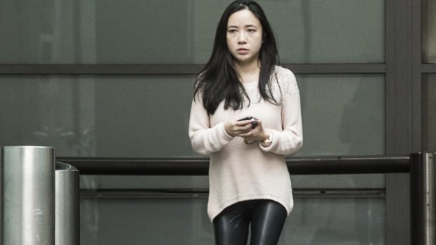 Yingying Dou leaves the Sydney premises where she works on Monday. 