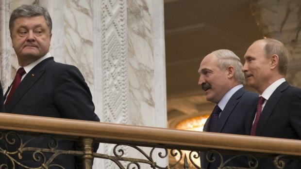 Don't look back: Ukrainian President Petro Poroshenko (left) walks in front of Russian President Vladimir Putin.