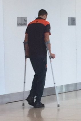 Shane Mumford is seen on crutches after the Giants' qualifying final at Adelaide Oval.