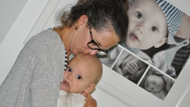 Healing hands: Lara-Jane with six-month-old Kobe