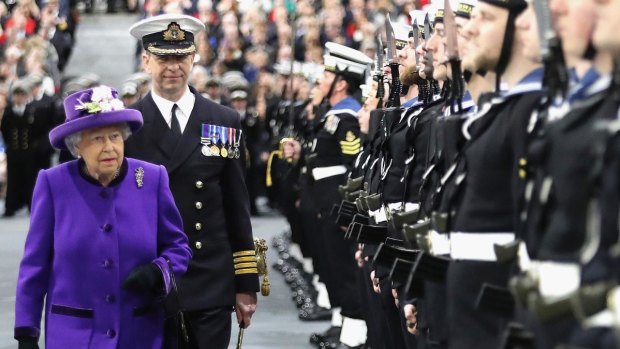Britain's Queen Elizabeth II attends the commissioning ceremony for HMS Queen Elizabeth at HM Naval Base on Portsmouth on December 7.